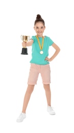 Happy girl with golden winning cup and medal isolated on white