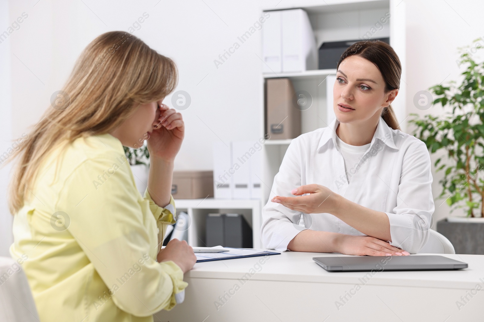 Photo of Mammologist consulting woman during appointment in hospital