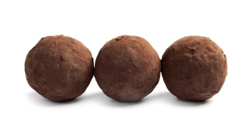 Photo of Delicious raw chocolate truffles on white background