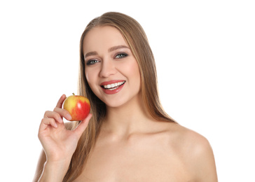 Photo of Young woman with apple on white background. Vitamin rich food