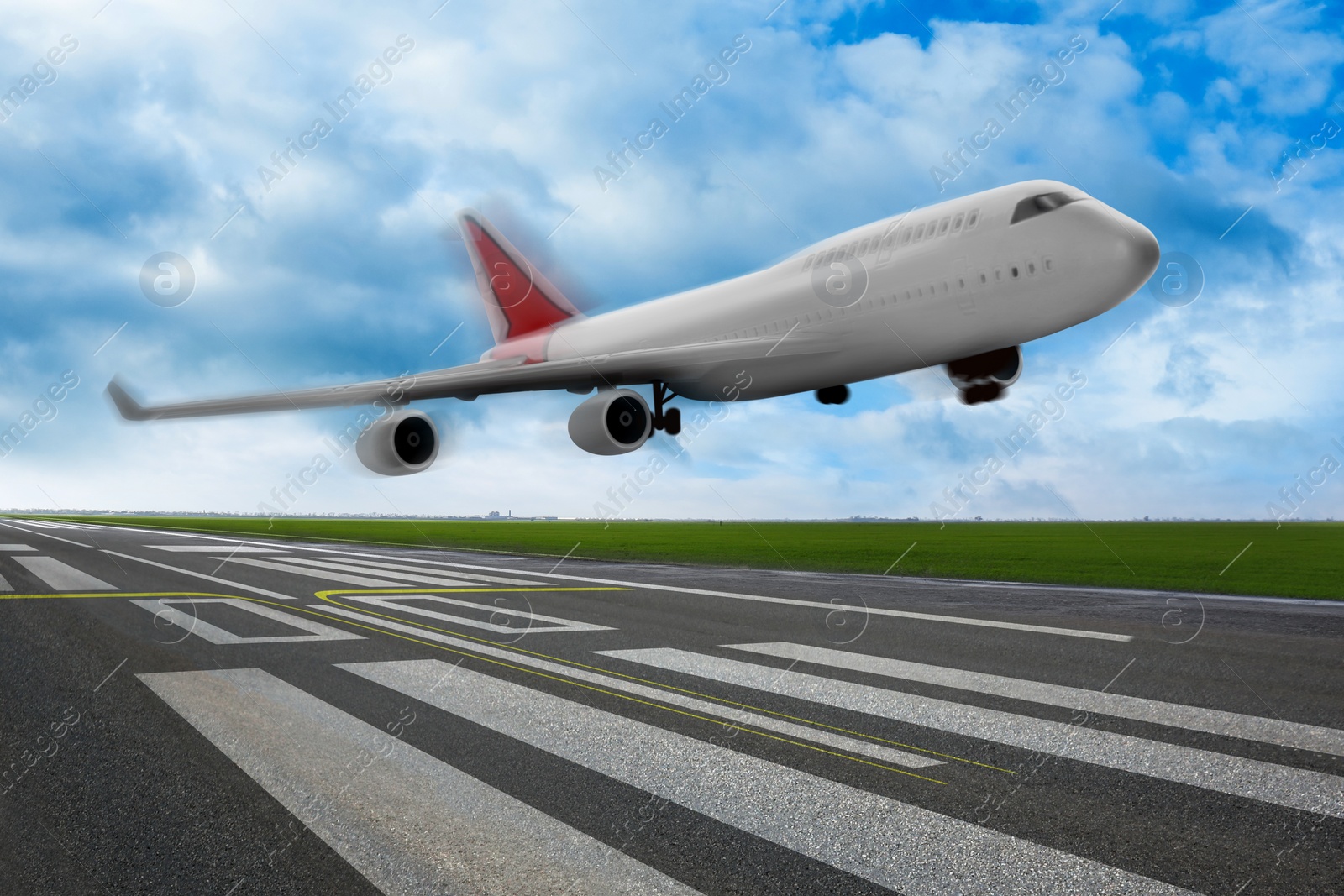 Image of Modern white airplane landing on runway 