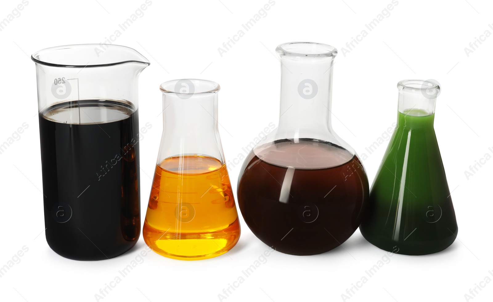 Photo of Beaker and flasks with different types of oil isolated on white