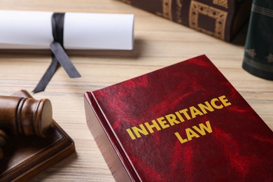 Image of Inheritance law book on wooden table, closeup