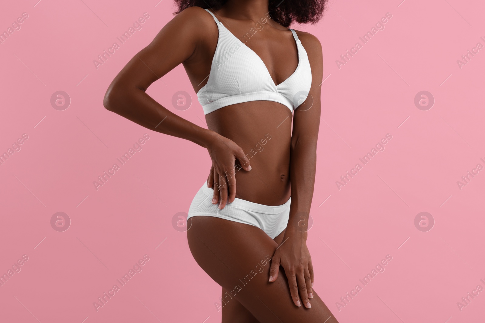 Photo of Woman in stylish bikini on pink background, closeup