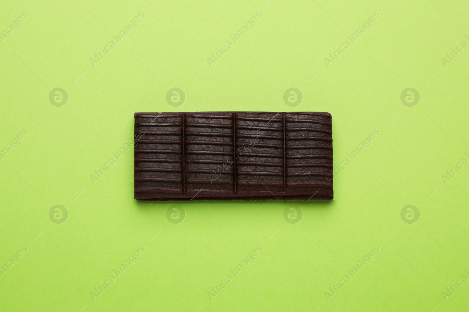 Photo of Hematogen bar on green background, top view