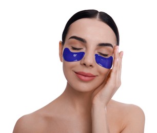 Photo of Beautiful young woman with under eye patches on white background