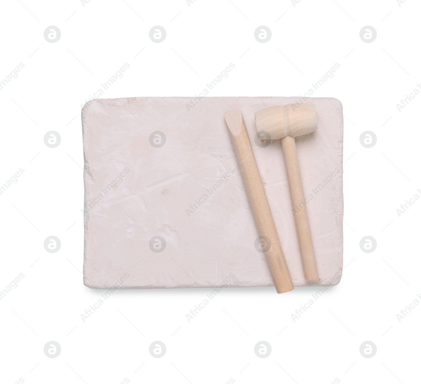 Photo of Educational toy for motor skills development. Excavation kit (plaster and digging tools) isolated on white, top view