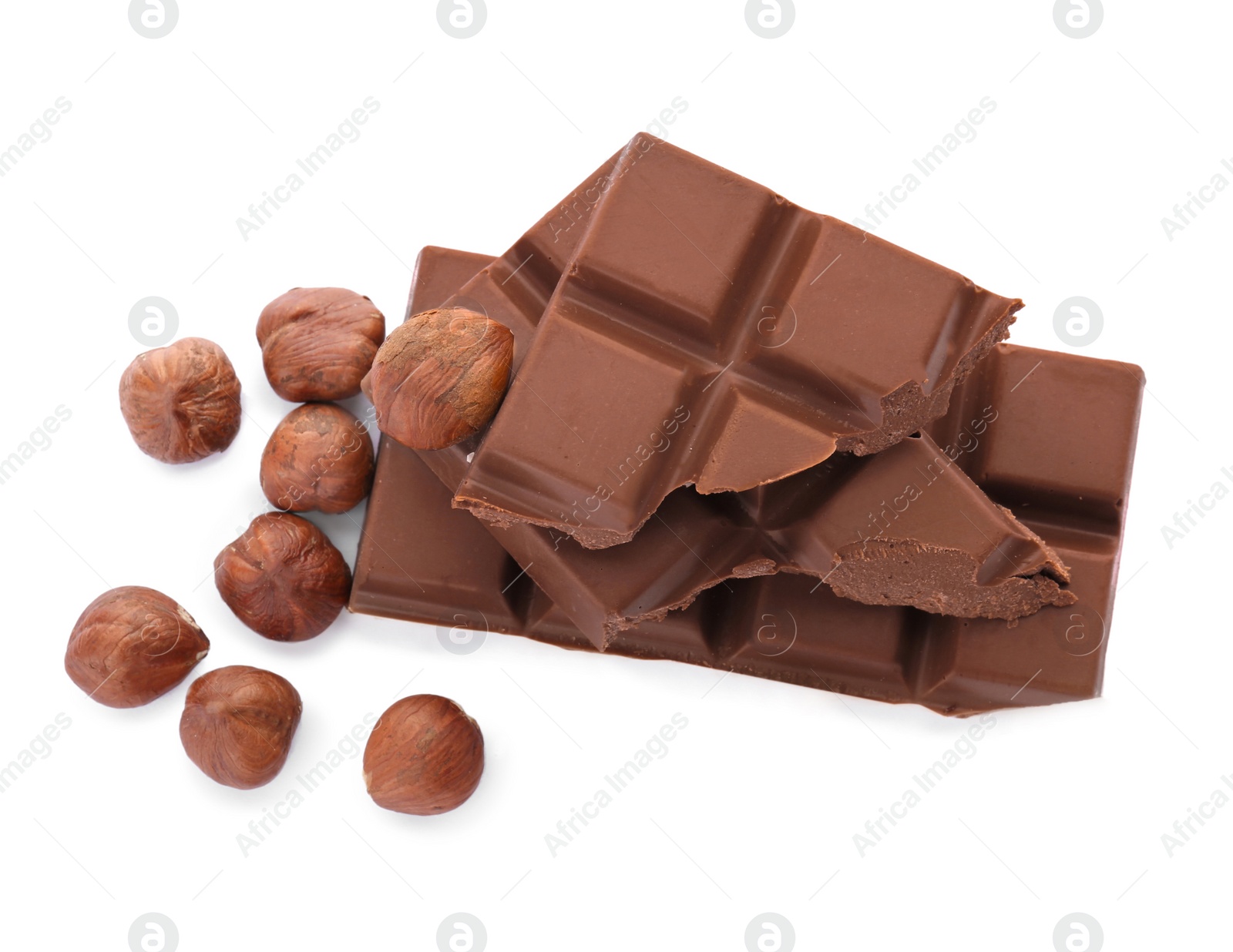 Photo of Delicious milk chocolate with nuts on white background