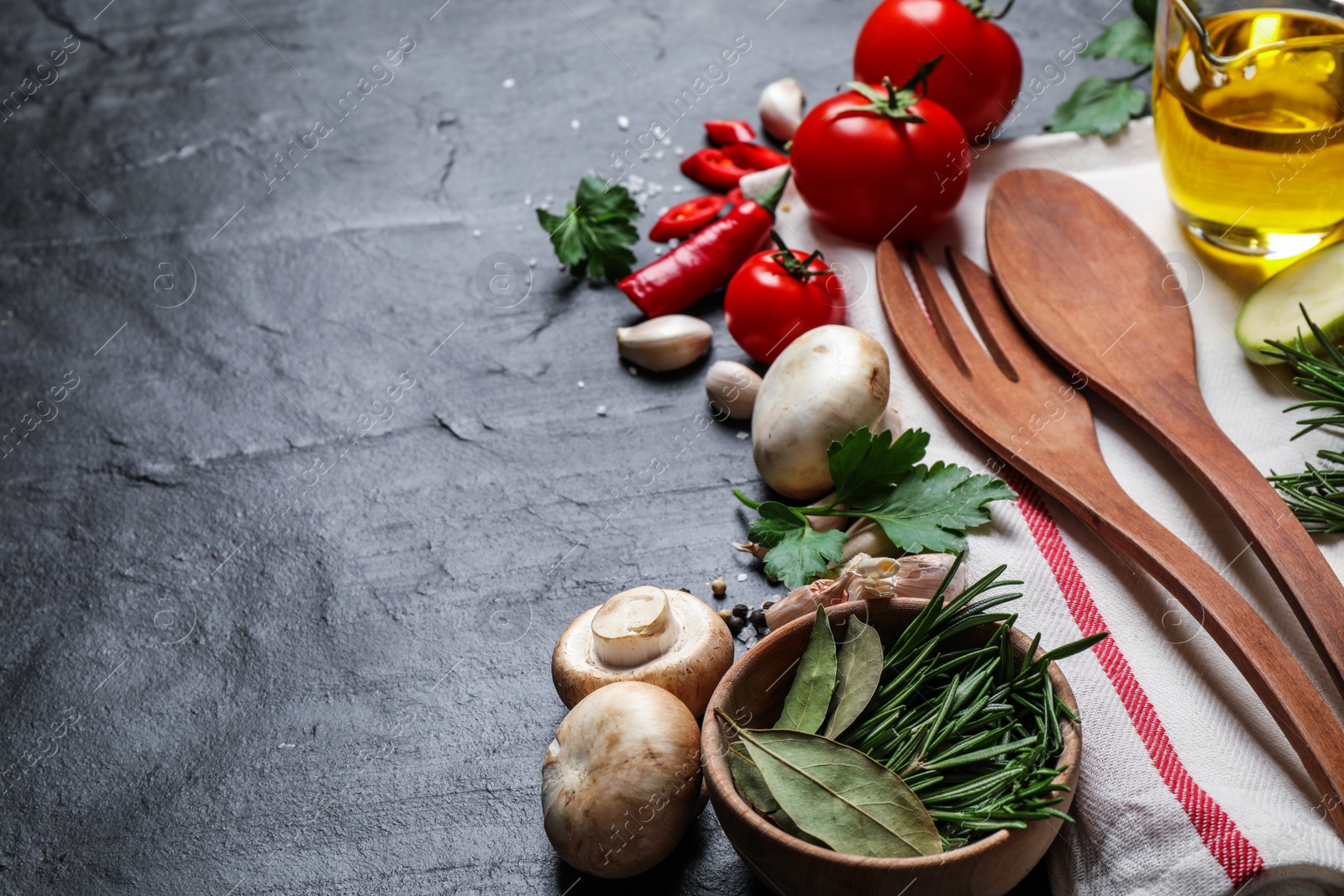 Photo of Fresh products on grey table, space for text. Healthy cooking