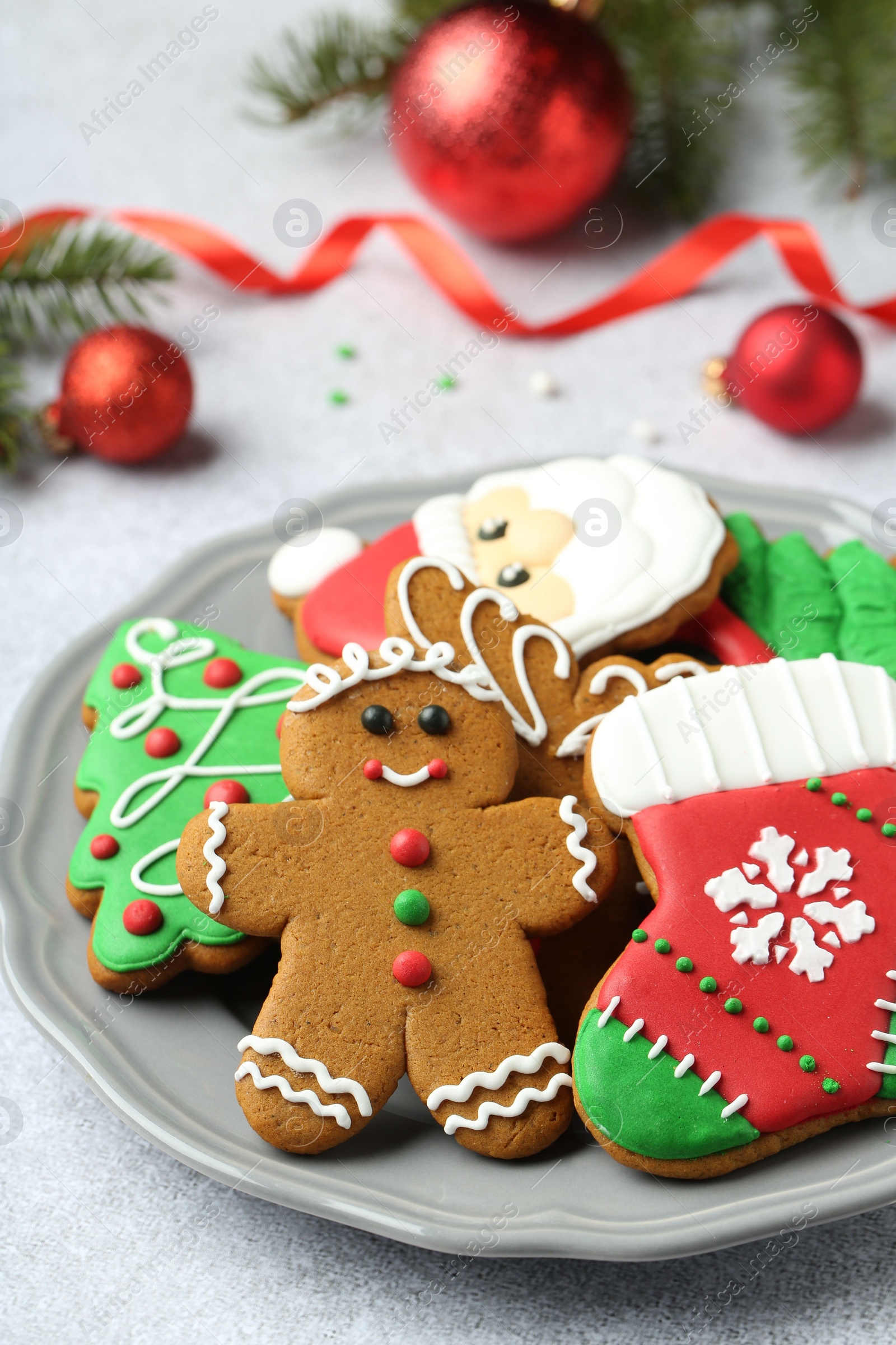 Photo of Tasty homemade Christmas cookies on light grey table