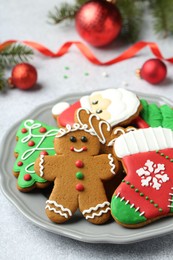 Photo of Tasty homemade Christmas cookies on light grey table