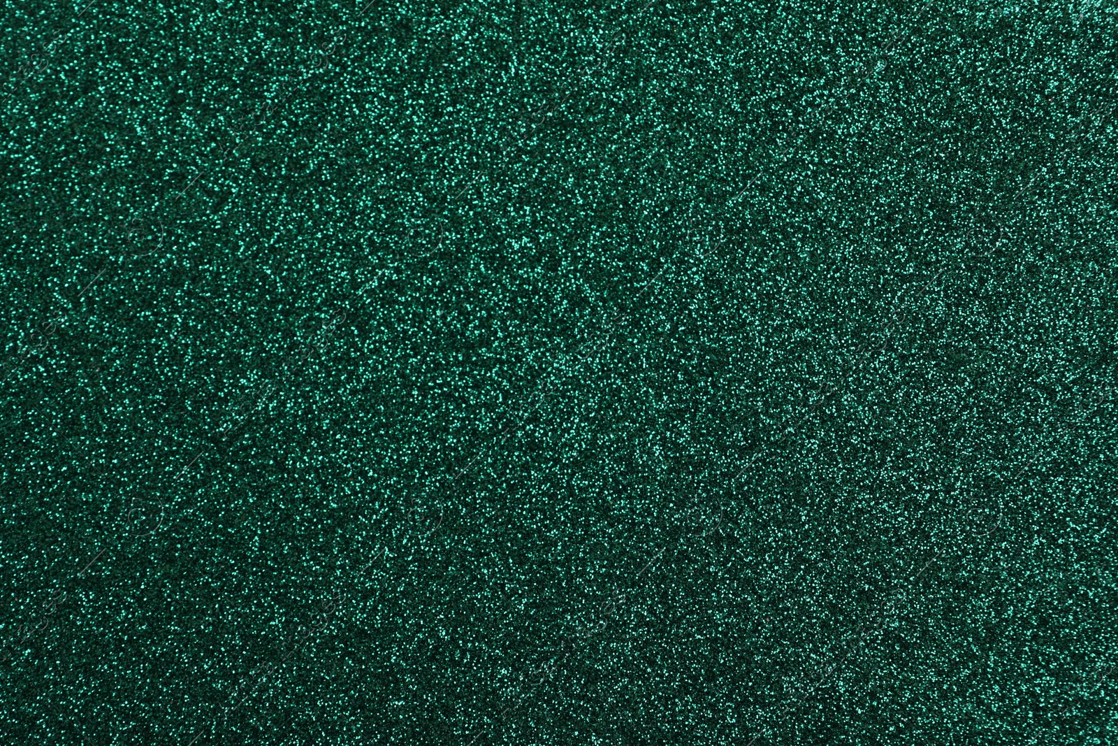 Photo of Shiny dark green glitter as background, closeup