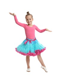 Photo of Cute little girl in costume dancing on white background