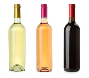 Image of Bottles of white, rose and red wine isolated on white