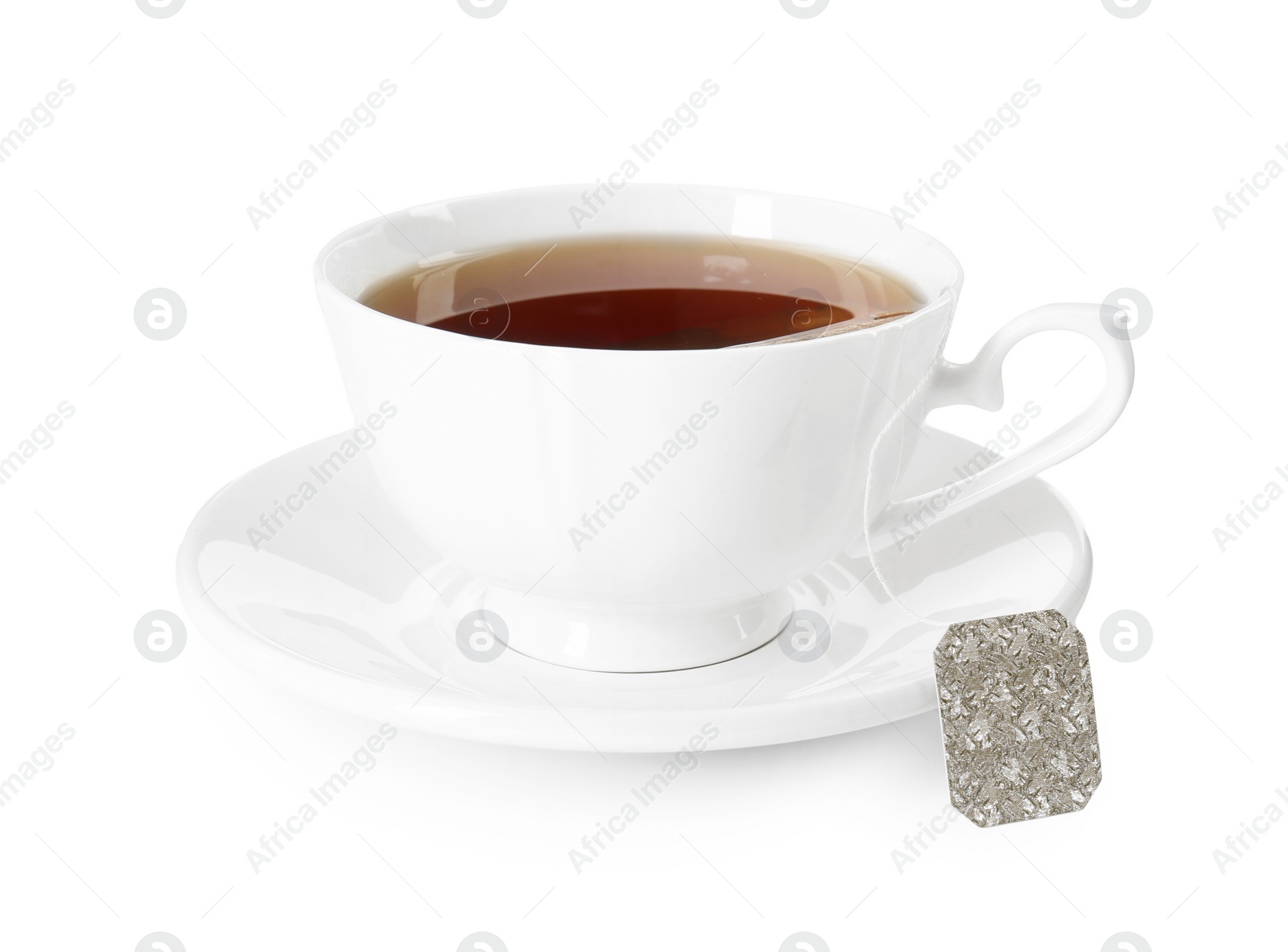 Photo of Brewing aromatic tea. Cup with teabag isolated on white