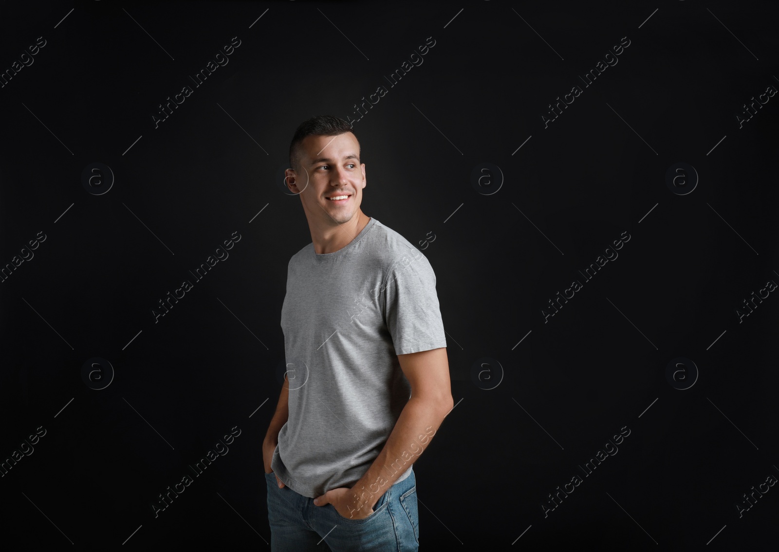 Photo of Portrait of handsome man on black background