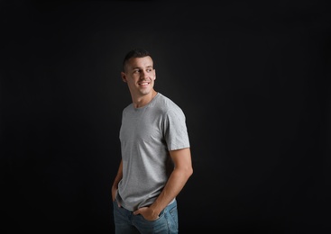 Portrait of handsome man on black background