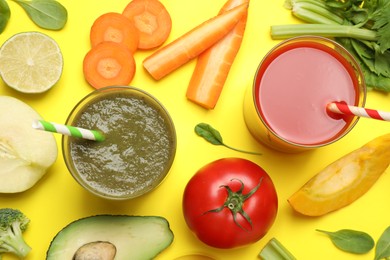 Photo of Delicious juices and fresh ingredients on yellow background, flat lay