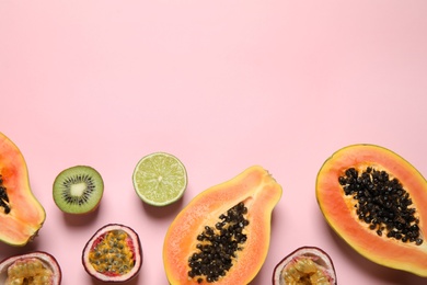 Photo of Fresh ripe papaya and other fruits on pink background, flat lay. Space for text