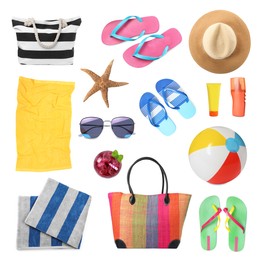 Set with towels and other beach accessories on white background