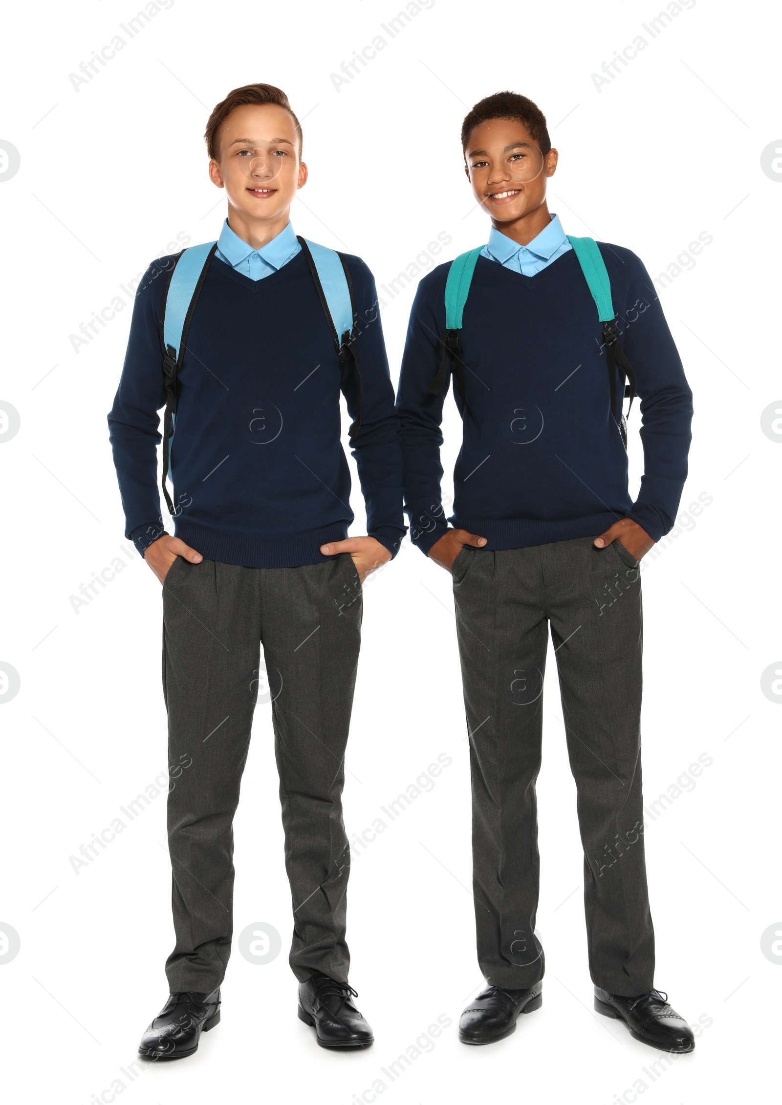 Photo of Teenagers in stylish school uniform on white background