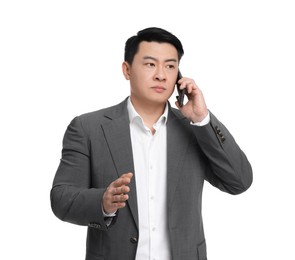 Photo of Businessman in suit talking on phone against white background