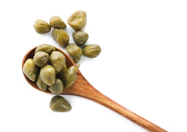 Photo of Wooden spoon and capers on white background, top view
