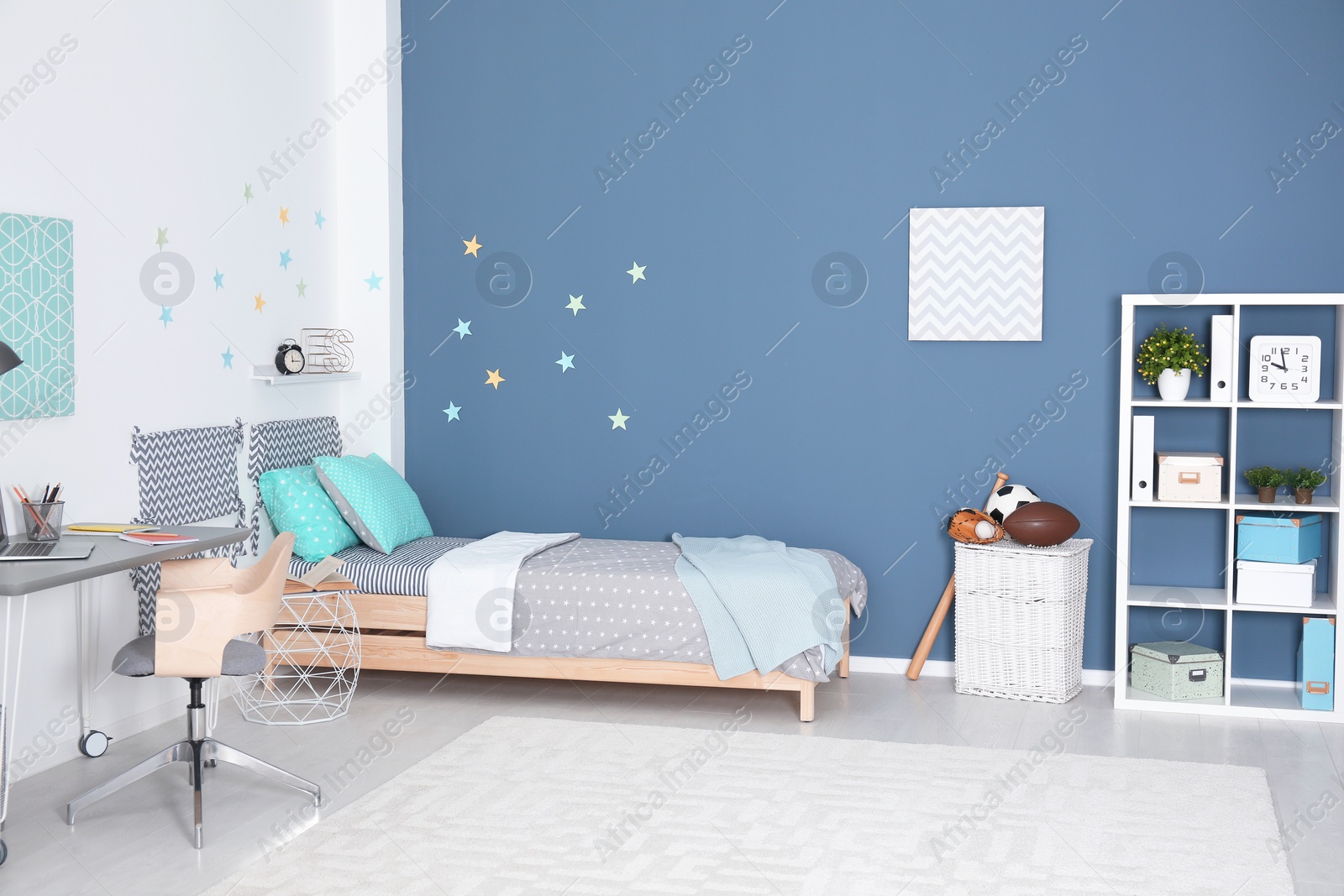 Photo of Modern child room interior with comfortable bed and desk