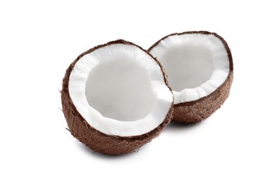 Photo of Halves of fresh ripe coconut on white background