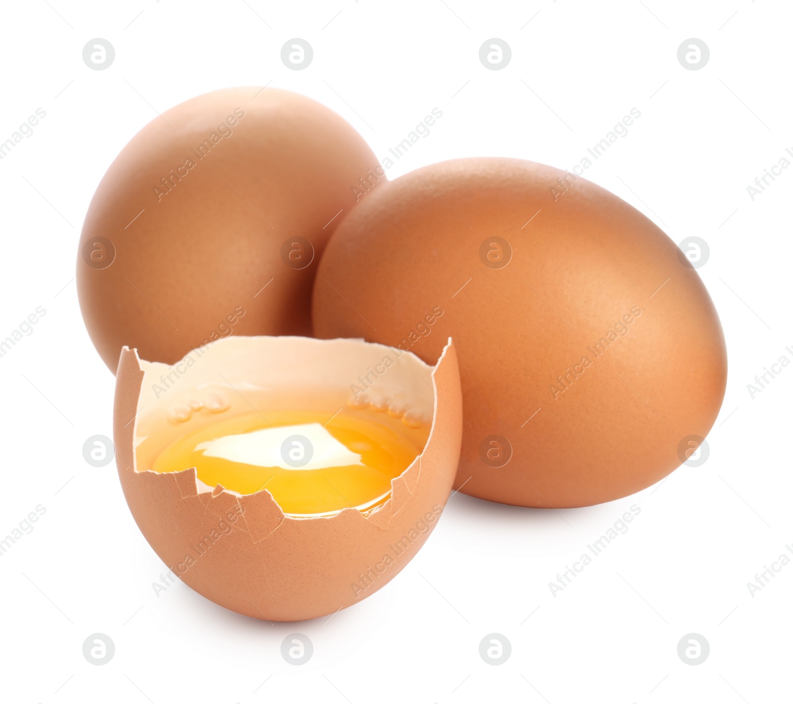 Photo of Whole and cracked chicken eggs isolated on white