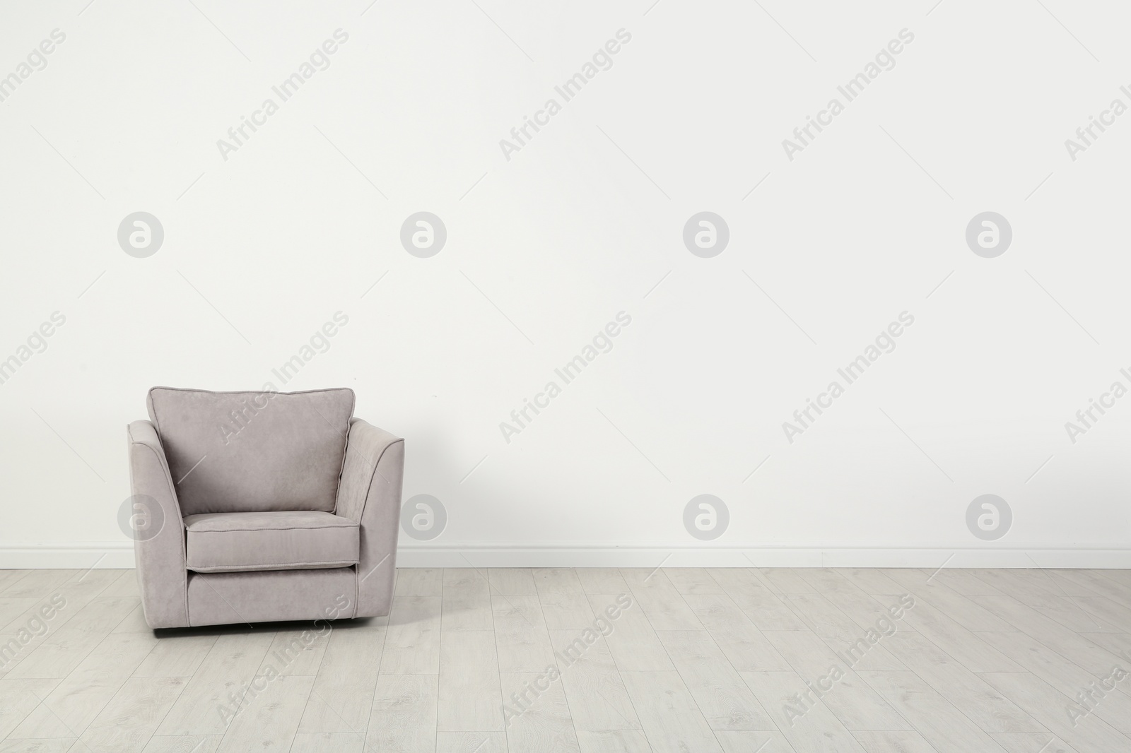 Photo of Stylish comfortable armchair indoors. House interior element