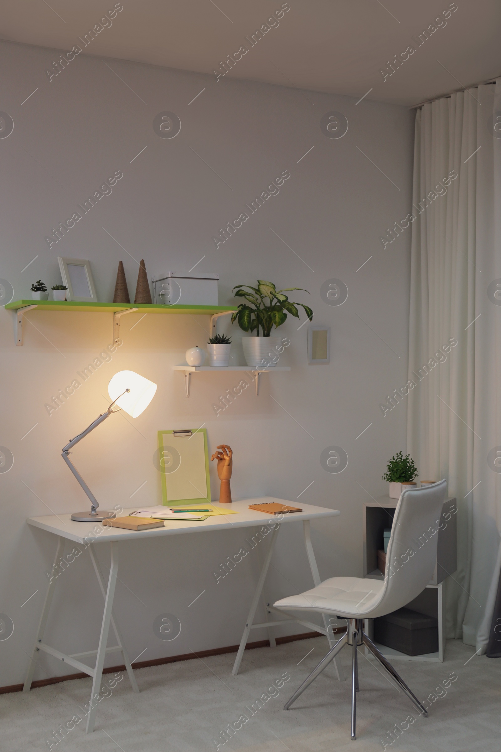 Photo of Stylish room interior with comfortable workplace. Design idea