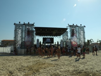 SENIGALLIA, ITALY - JULY 22, 2022: Blurred view of people enjoying music festival on beach