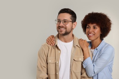 Photo of International dating. Portrait of happy couple on light grey background