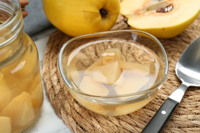 Photo of Delicious quince drink and fresh fruits on table, closeup