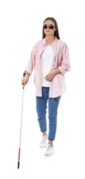 Photo of Blind woman with long cane on white background