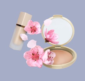 Image of Spring flowers and makeup products in air on grey background