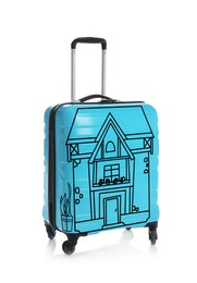Turquoise suitcase with drawing of house on white background. Moving concept