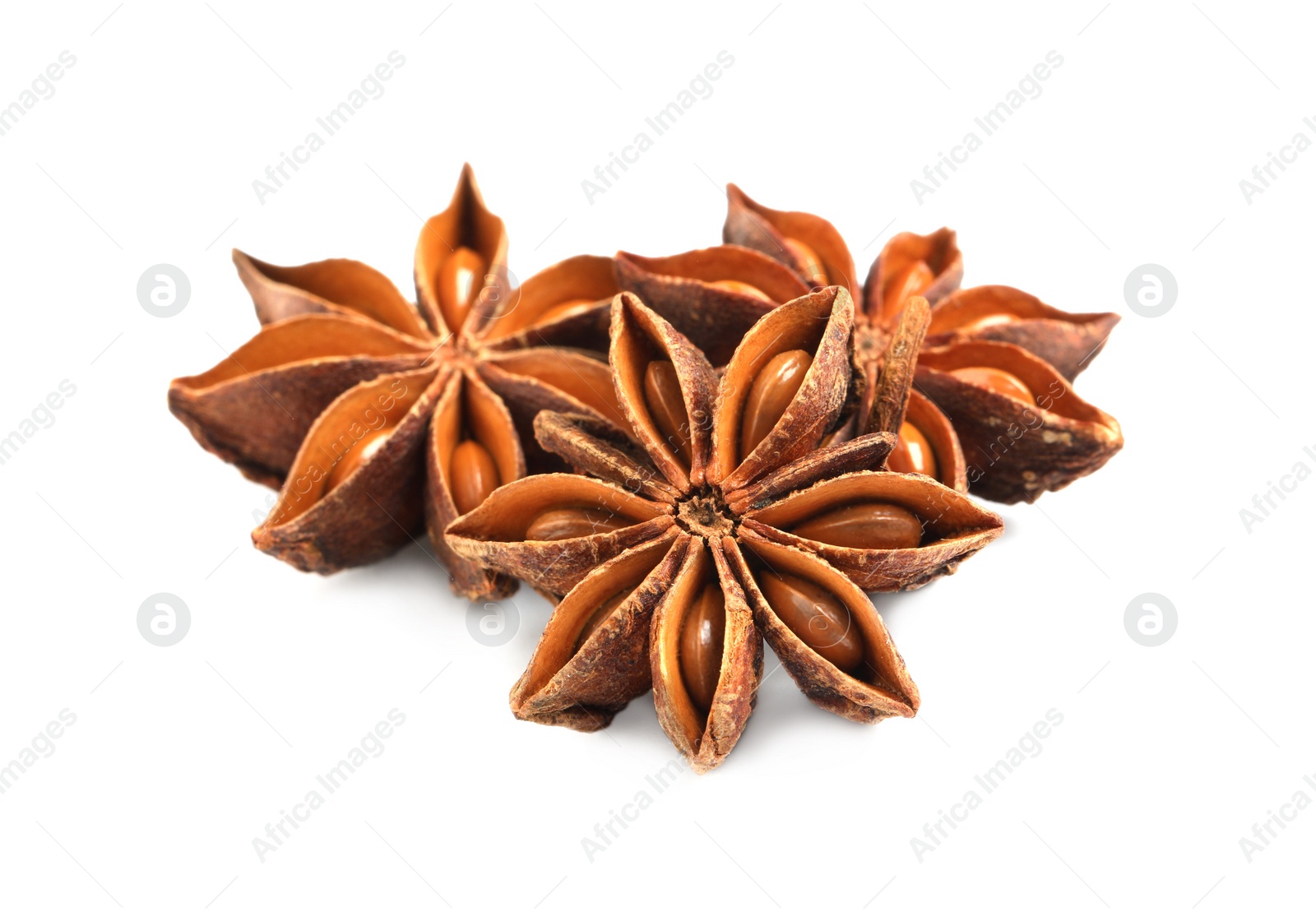 Photo of Dry anise stars with seeds on white background