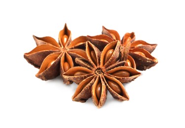 Dry anise stars with seeds on white background