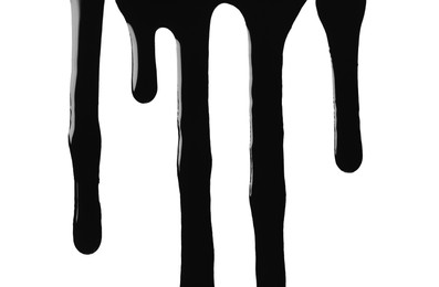 Photo of Black glossy oil flowing on white background