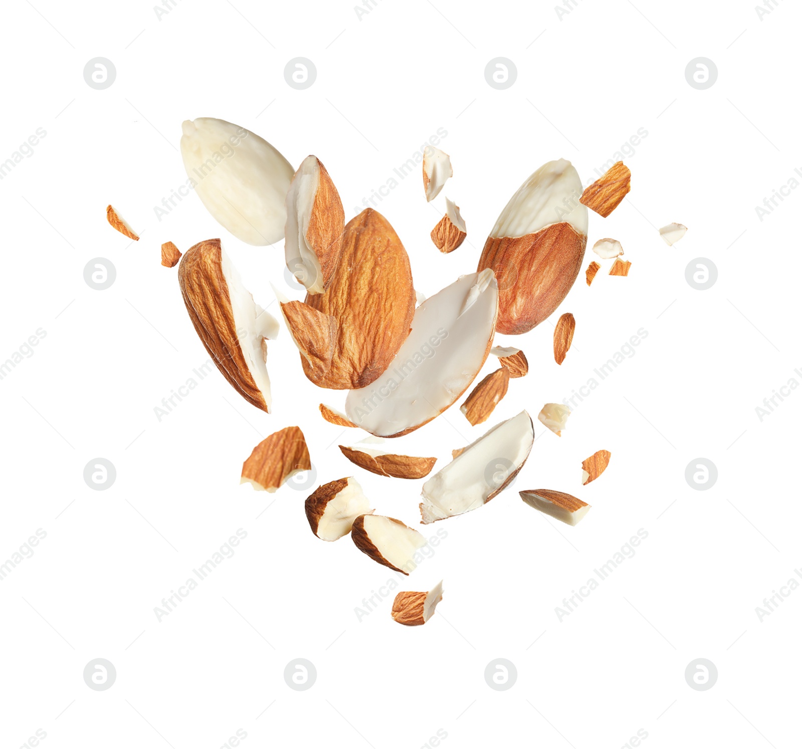 Image of Pieces of tasty almonds falling on white background