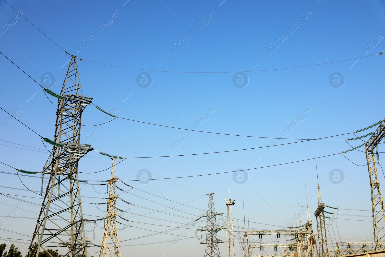 Photo of Modern electrical substation on sunny day, low angle view