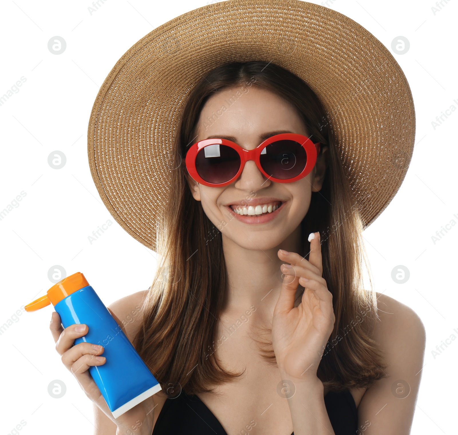 Photo of Young woman applying sun protection cream on white background