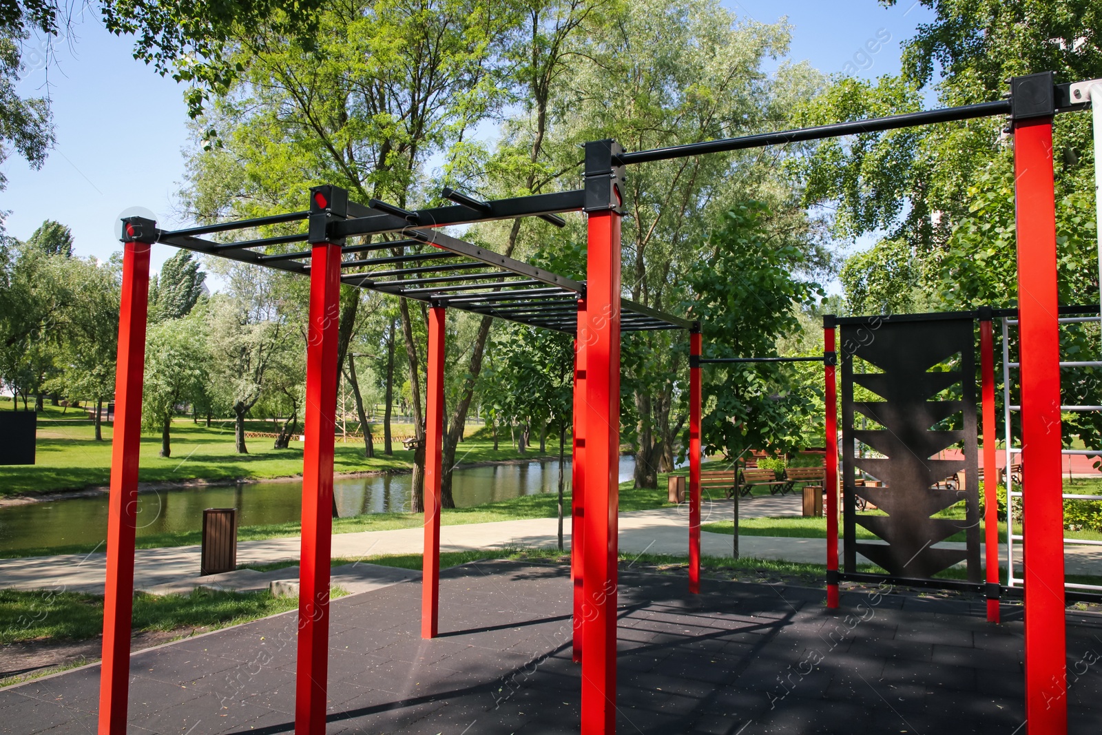 Photo of Empty outdoor gym with exercise equipment in park