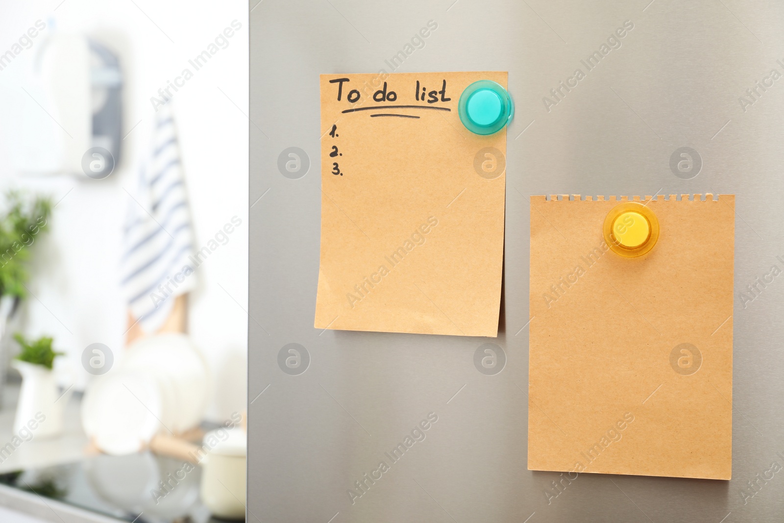 Photo of To do list and empty sheet of paper with magnets on refrigerator door in kitchen. Space for text