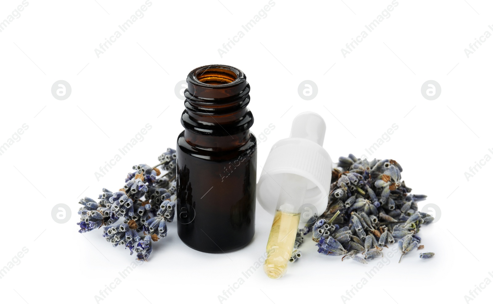 Photo of Bottle of essential oil and flowers on white background