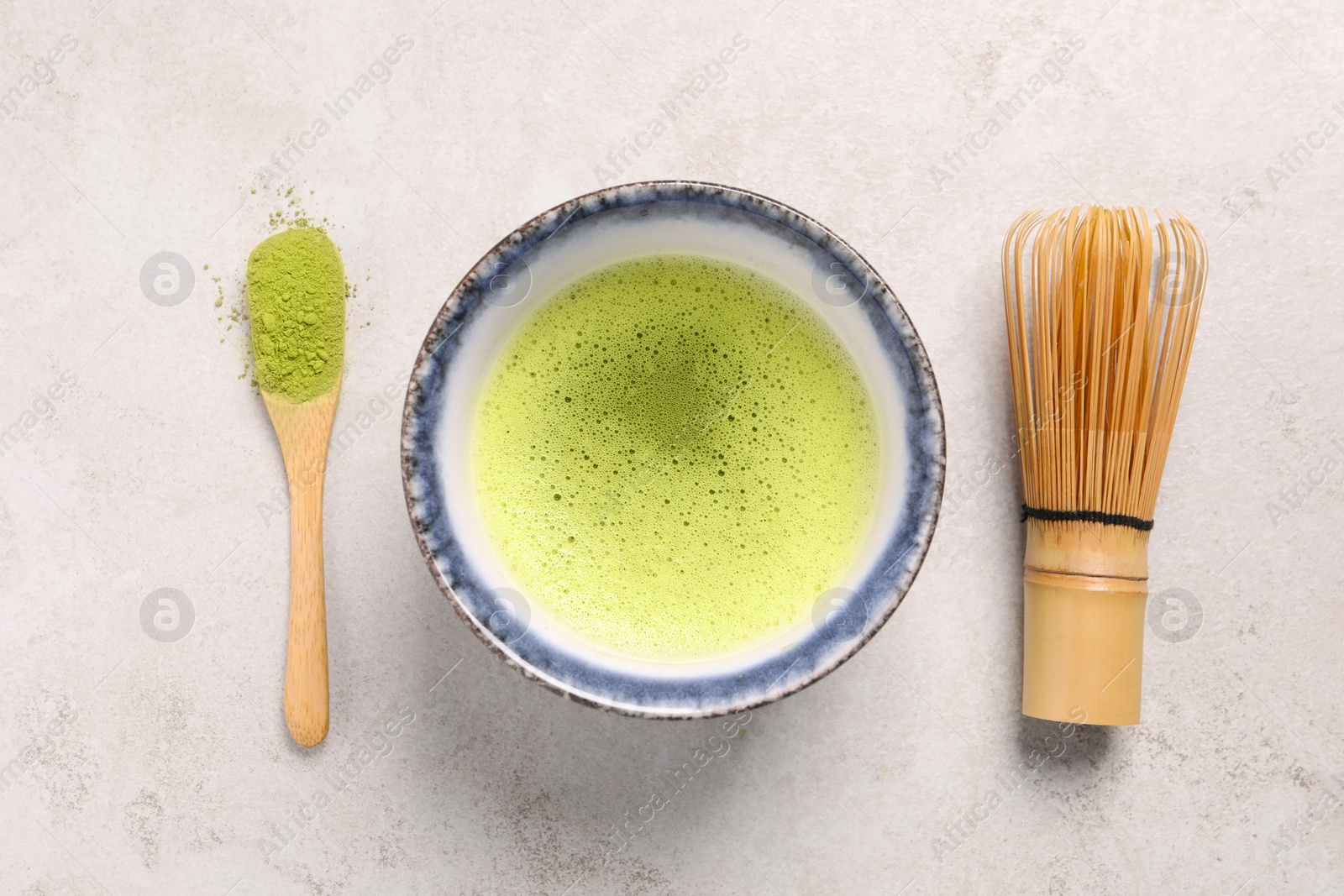 Photo of Flat lay composition with matcha tea on light gray textured table