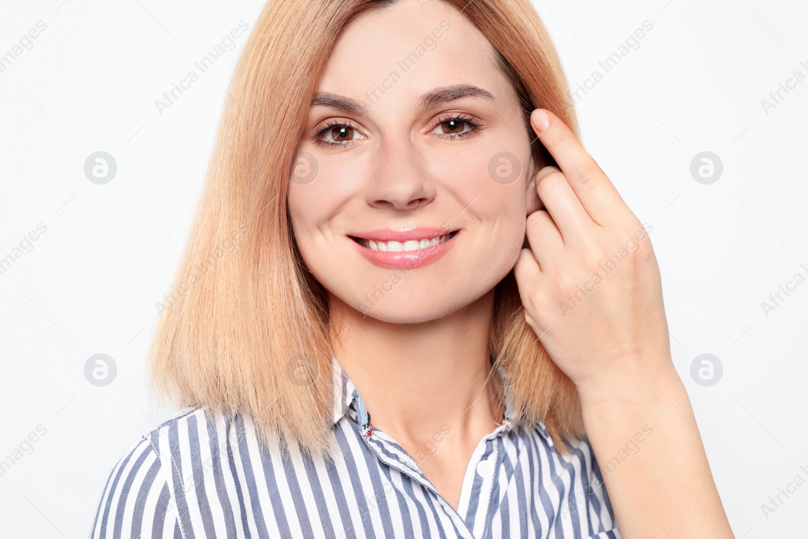 Photo of Portrait of woman with beautiful face on white background