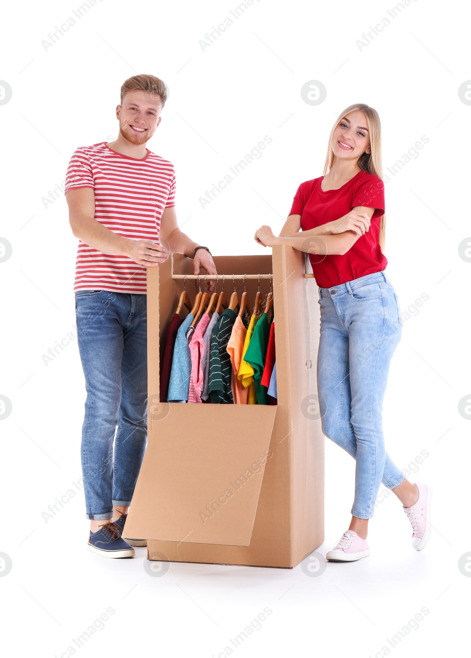 Photo of Young couple near wardrobe box on white background